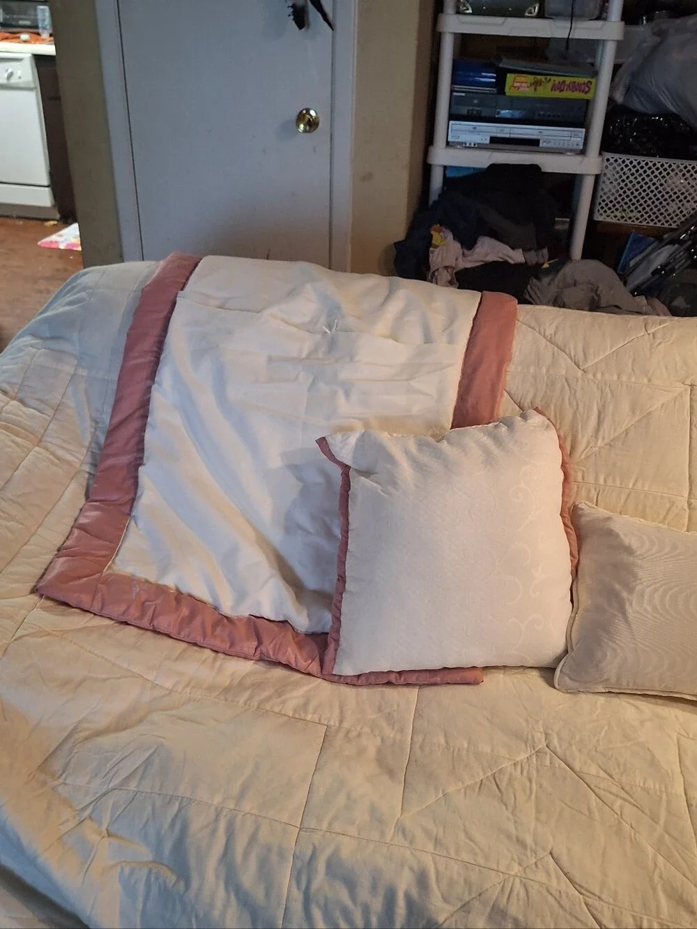 handmade queen size quilt in pink and white with 2 pillow shams and 2 small pill